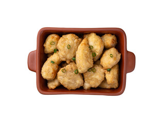Breaded chicken bites in a plate isolated over white background
