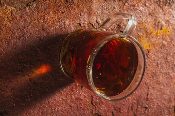 Still life - tea time. Mug of hot drink on a bright background - top view