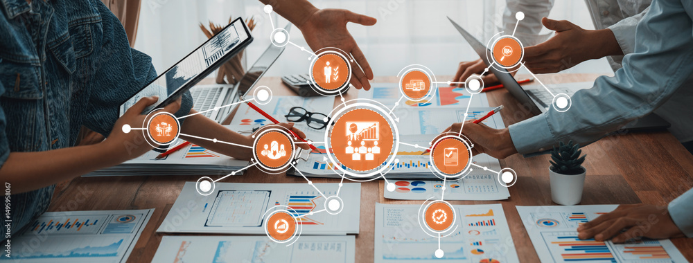Fototapete Analyst team utilizing BI Fintech to analyze and pointing at financial dashboard paper office. Businesspeople examining report paper on table for business insight. Panorama shot. Scrutinize Amity