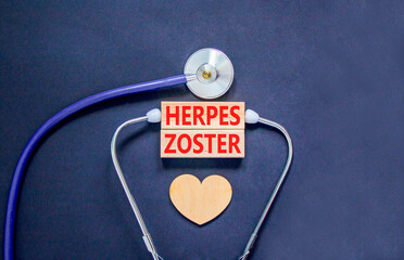 Herpes zoster symbol. Concept words Herpes zoster on beautiful wooden blocks. Wooden heart and...