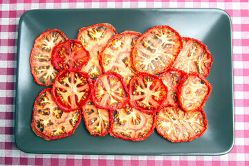 dried tomato slices on a plate. Vitamin vegetable food