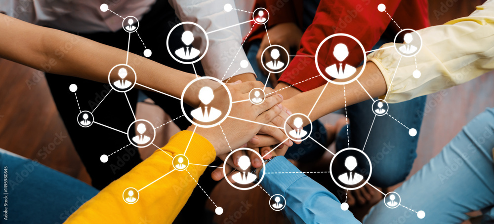 Poster a dynamic scene showcasing a diverse group of individuals collaborating with hands joined, symbolizi