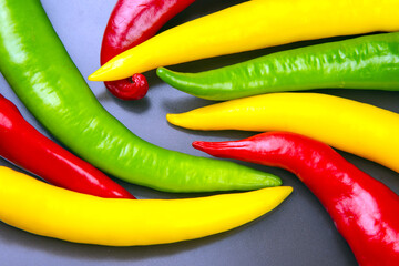 yellow, red and green hot chili on a plate. Pepper. Vegetable vitamin food.