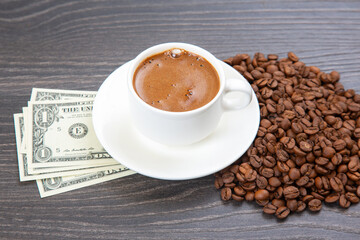 Enjoying a rich cup of coffee with fresh beans and a touch of cash on a wooden table. coffee business