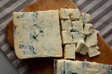 Blue cheese Gorgonzola on a Wooden Board, top view.