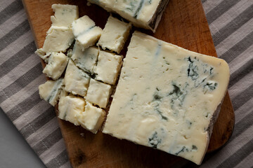 Blue cheese Gorgonzola on a Wooden Board, top view. Close-up.