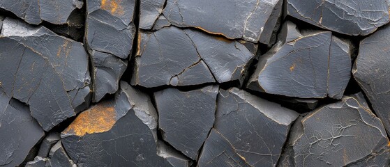 A close-up view of a rough, cracked, and textured surface, possibly a rock face or a piece of metal.
