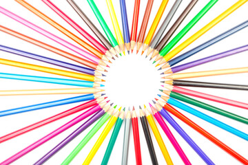 A rainbow of colored pencils fanning out in a circular formation on a white background. Great for...