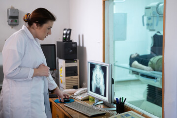 Radiologist Analyzing X Ray Scans in a Medical Imaging Room.