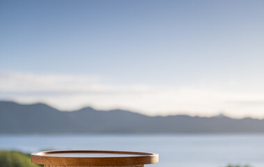 An empty table with the sea in the background
