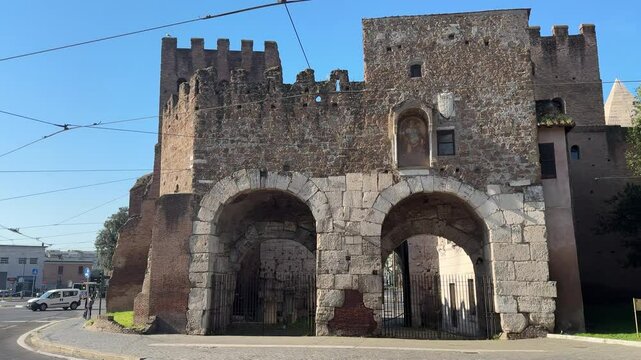Ancient gate in Rome&rsquo;s Aurelian Walls. Historic stone archway serving as an entrance to the city&rsquo;s defensive walls, showcasing Roman military architecture.

