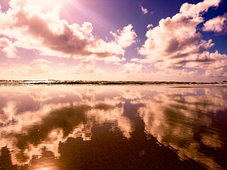 clouds reflected on the calm sea