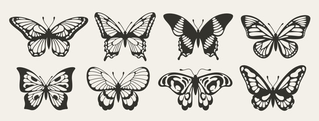 Fototapeta na wymiar Silhouettes of butterflies. Set of doodle icons of insects with beautiful wings. Design elements for tattoos and logos. Black and white vector illustration collection isolated on background