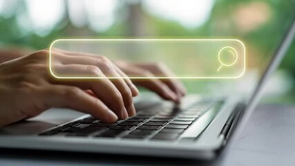 Navigating the Digital Frontier: A close-up view of hands typing on a laptop keyboard, with a glowing search bar.