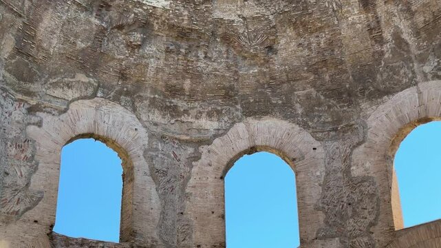Ruins of the Temple of Minerva in Rome, Italy. Ancient Roman temple remains with stone walls and historical significance near the Forum of Nerva.

