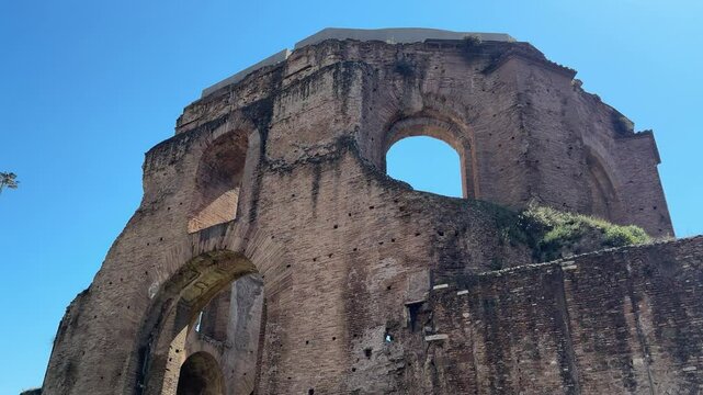 Ruins of the Temple of Minerva in Rome, Italy. Ancient Roman temple remains with stone walls and historical significance near the Forum of Nerva.


