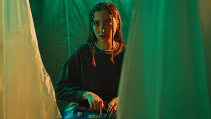 Moody Portrait of Woman in Artistic Green Lighting