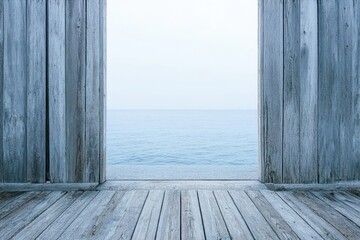 A serene view of the ocean seen through weathered wooden planks.