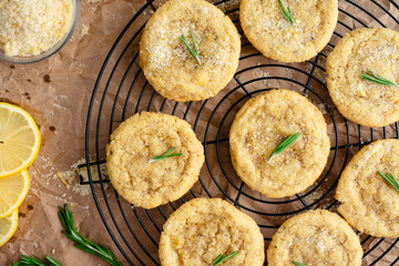 Rosemary-Lemon Sugar Cookies on Round Wire Cooling Rack: Overhead close-up of freshly baked homemade sugar cookies cooling on a wire rack