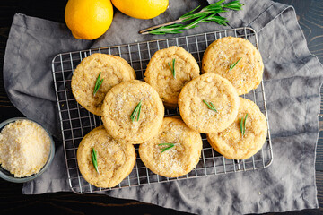 Rosemary-Lemon Sugar Cookies Stacked on a Wire Rack: Directly above stacks of freshly baked homemade sugar cookies on a wire cooling rack