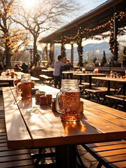 Iced tea in mason jars on wooden tables at an outdoor restaurant with string lights and trees around