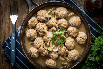 Delicious homemade swedish meatballs with mushroom cream sauce. Small depth of field. Top view.