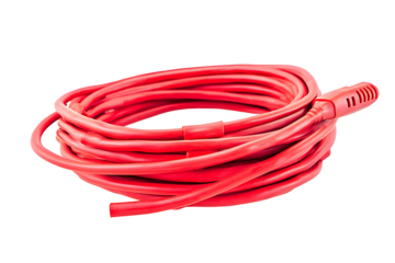 A coiled red extension cord with a plug isolated on a black background in a studio setting