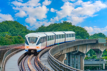 Electric train bright light railway carriage rushes turn travels along route railway road viaduct
