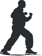 Silhouette of a man in a fighting stance practicing boxing or martial arts training exercise