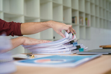Office employee working with documents at table, closeup