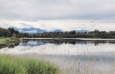Spectacular view of Westchester Lagoon near Anchorage, Alaska, United States. The Chugach Mountains are visible on the horizon. Alaskan Landscape.