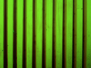 Corrugated steel sheet painted with green paint.