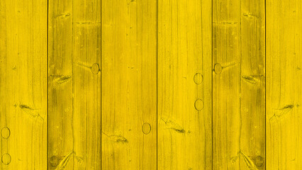 old wooden fence with yellow paint.