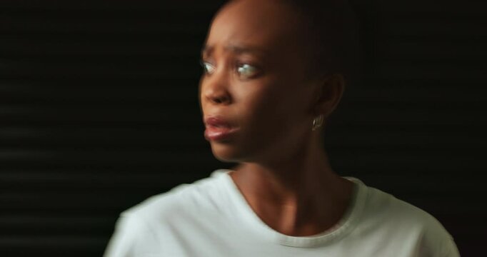 Confused, mental health and woman in studio scared for trauma, emotional abuse and schizophrenia. Psychology, long exposure and person with anxiety, depression and paranoid on black background