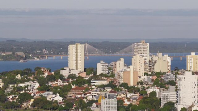 Lateral drone movement revealing San Roque Gonz&aacute;lez bridge in the background, Posadas, Argentina.
