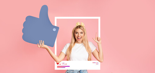 A young influencer joyfully poses against a pink background, holding a large thumbs up symbol. She showcases excitement while interacting with her online audience, promoting positivity and engagement.