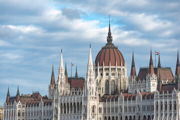 Fototapeta premium The Hungarian parliament building in Budapest is standing on the bank of the Danube river
