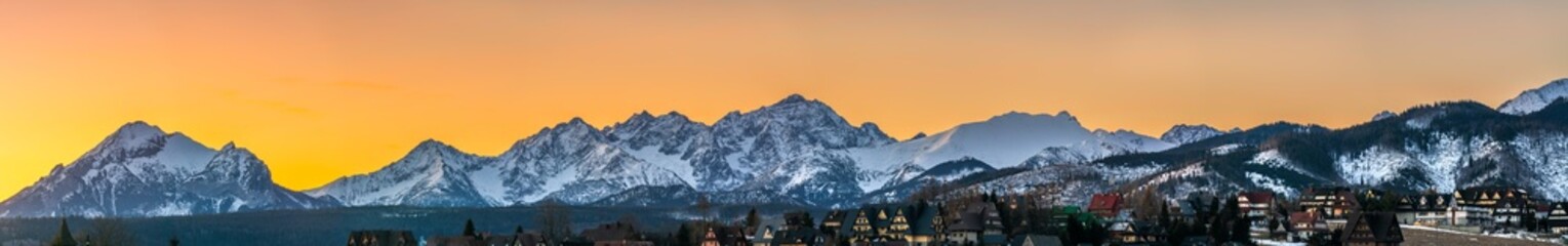 Tatra mountains peak at sunrise seen from Murzasichle village. Winter in Polish mountain region