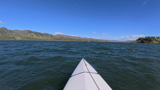 First person POV from paddling a kayak or canoe against heavy headwind on Horsetooth Reservoir in Colorado
