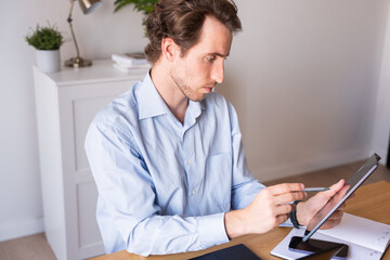 Obraz premium Executive reviewing daily agenda in a home office