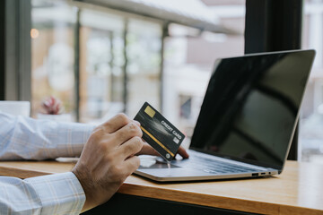 Online Shopping with Credit Card on Laptop