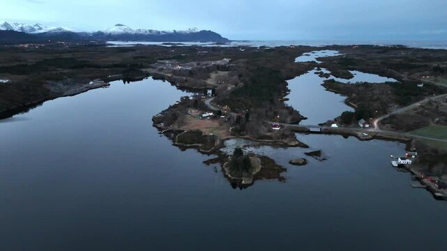 Aerial view of the scenic Hendvaagen bay in Averoy municipality, near Kristiansund, Norway at dusk