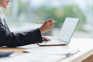 Businesswoman Working on Laptop at Desk
