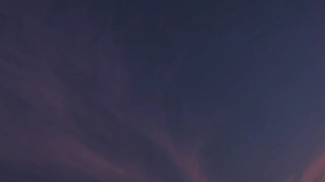 Serene twilight pink clouds in sky