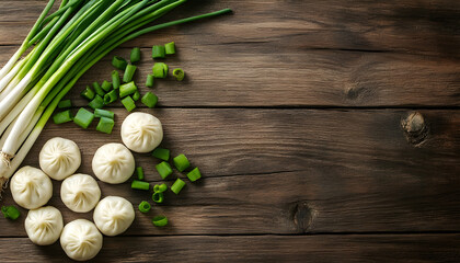 Tasty dumplings with green onion on wooden table, top view. Space for text