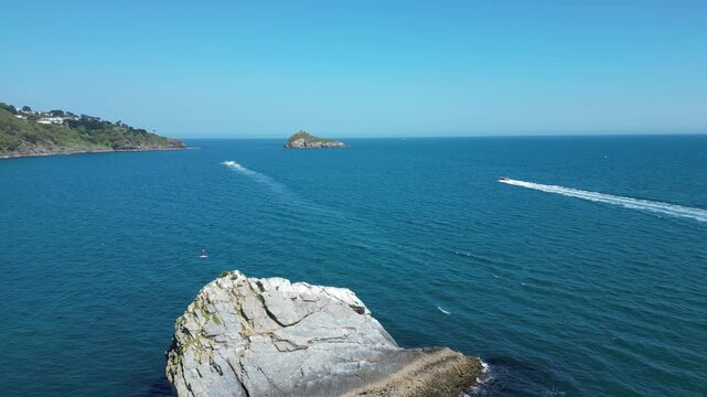 Torbay, South Devon, England: DRONE VIEWS: A speedboat heads across the bay in the direction of Thatcher Rock. Torbay is a popular UK holiday destination (Clip 3).