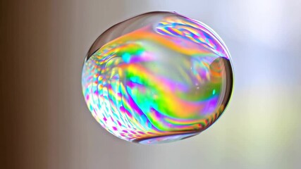 Colorful iridescent soap bubble floating, with swirling rainbow light reflections on a blurred background - Powered by Adobe