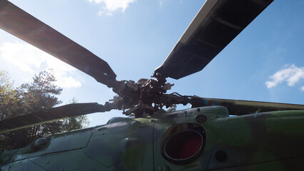 Close-up view of helicopter rotor blades in a vintage Soviet design, highlighting the intricate...