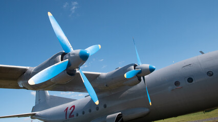 A close look at a vintage Soviet aircraft with blue propellers showcases its design during a Russian aviation event, evoking nostalgia for aviation history. © bisonov
