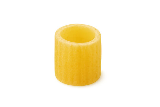 Close-up of one uncooked paccheri pasta piece, showcasing its cylindrical shape and ribbed texture, isolated on a transparent background